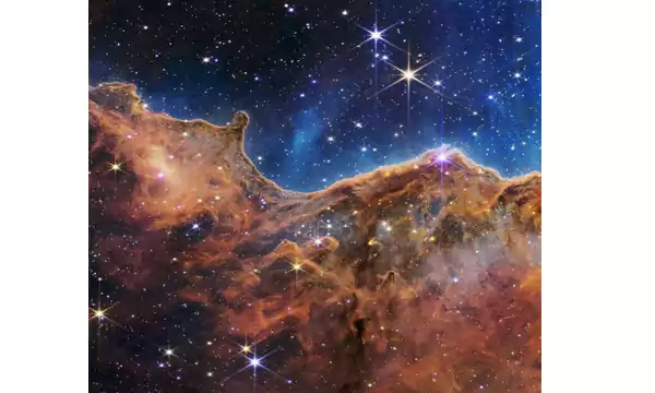 curtain of dust and gas in these “Cosmic Cliffs”